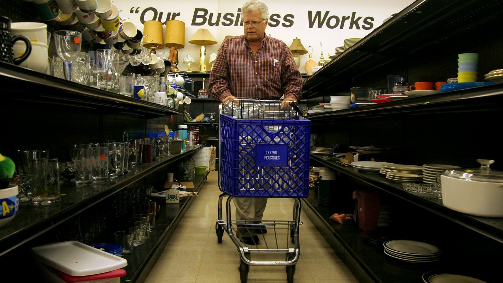 Tom Nordberg, a retired pastor from Columbia, Mo., shops for pint glasses at a Goodwill store in Columbia, Mo. (AP/Dan Gill)