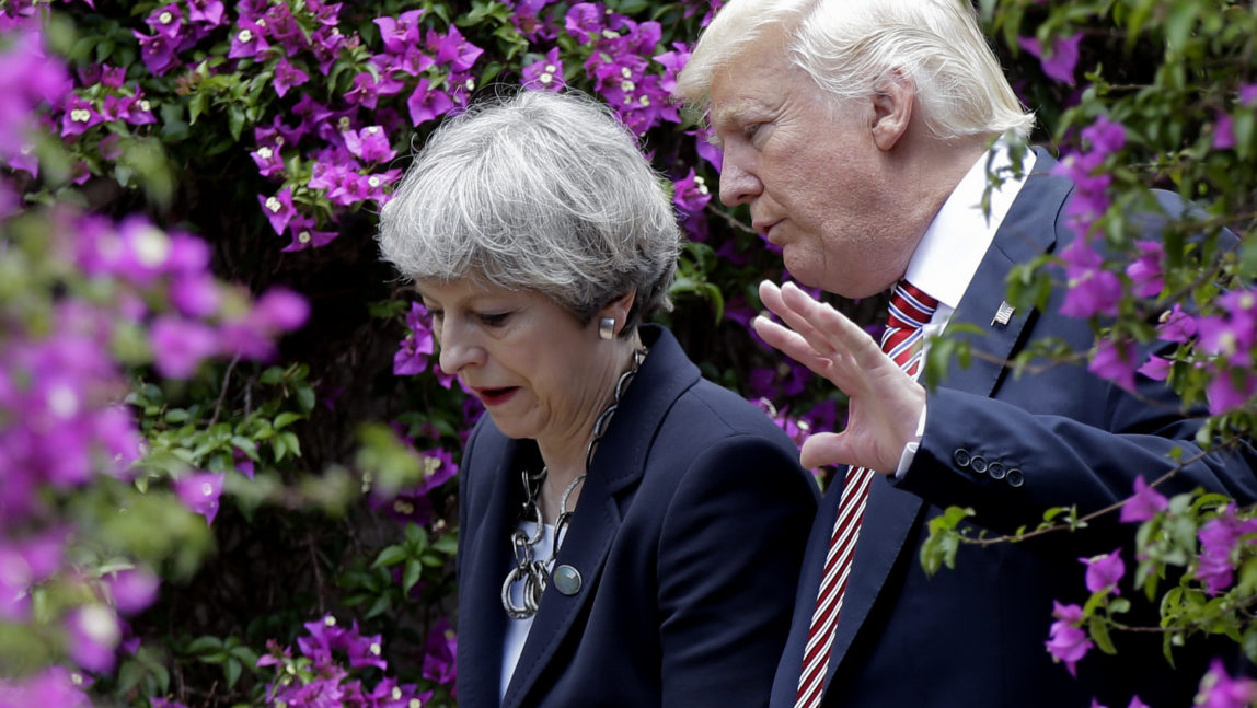 U.S. President Donald Trump, right, talks with British Prime Minister Theresa May in Taormina, Italy, May 26, 2017. (AP/Luca Bruno)