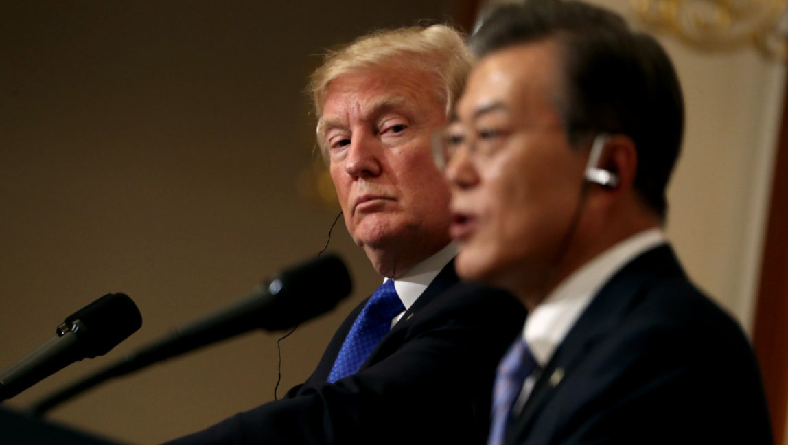 President Donald Trump, left, listens to South Korean President Moon Jae-in during a joint news conference at the Blue House in Seoul, South Korea, Nov. 7, 2017. President Donald Trump, on his first day on the Korean peninsula, signaled a willingness to negotiate with North Korea to end its nuclear weapons program, urging Pyongyang to "come to the table" and "make a deal." (AP/Andrew Harnik)