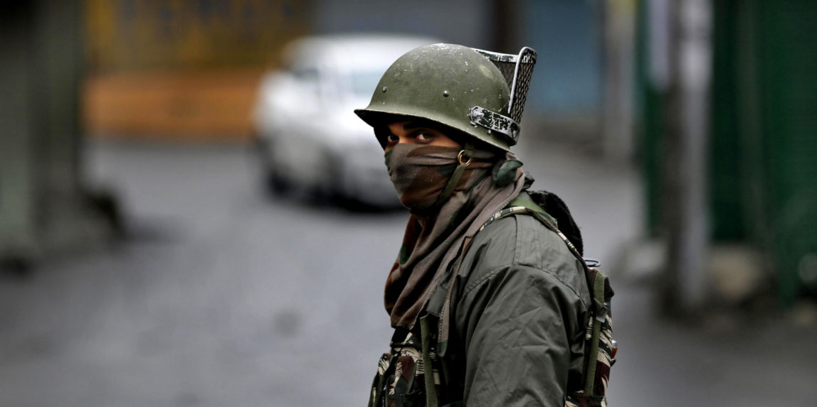 An Indian paramilitary force soldier guards at a check point during a strike in Srinagar, Kashmir, Dec. 20, 2017. (AP/Mukhtar Khan)