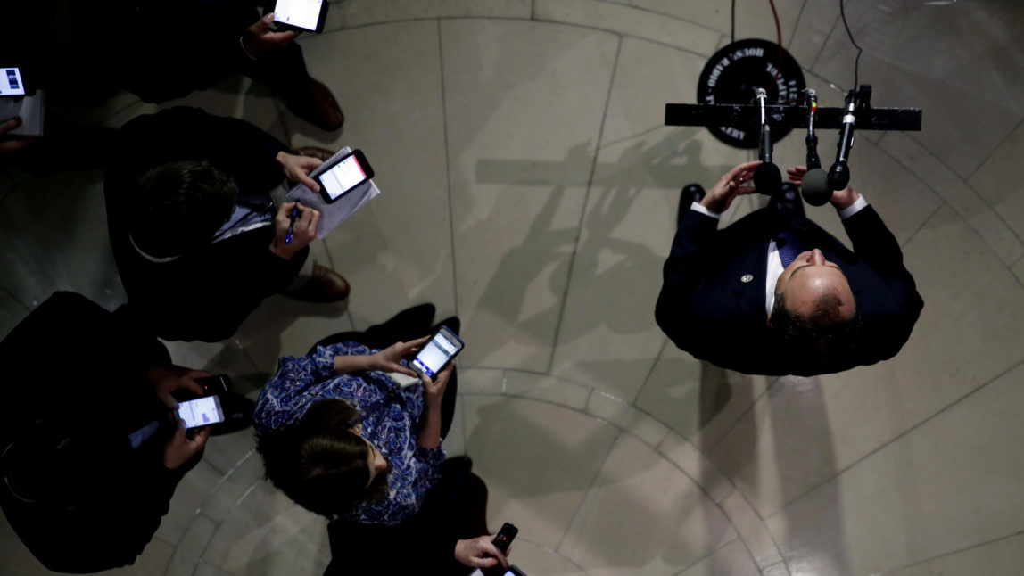 Rep. Adam Schiff, D-Calif., ranking member of the House Committee on Intelligence, speaks during a media availability as reporters keep an eye on their phones, after a closed-door meeting of the House Intelligence Committee on Capitol Hill, Feb. 5, 2018 in Washington. (AP/Alex Brandon)