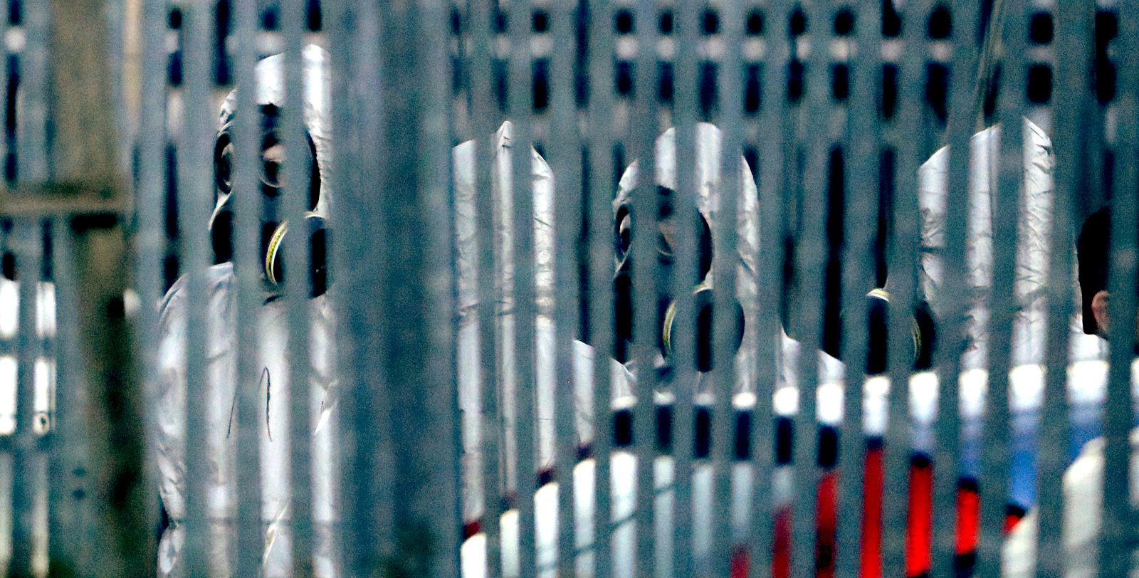 Police officers wear protective suits inside the fence of "Ashley Wood Recovery", a vehicle recovery business in Salisbury, England, March 13, 2018. The use of Russian-developed nerve agent Novichok to poison ex-spy Sergei Skripal and his daughter makes it "highly likely" that Russia was involved, British Prime Minister Theresa May claimed. Novichok refers to a class of nerve agents developed in the Soviet Union and possessed by multiple governments. (AP/Matt Dunham)