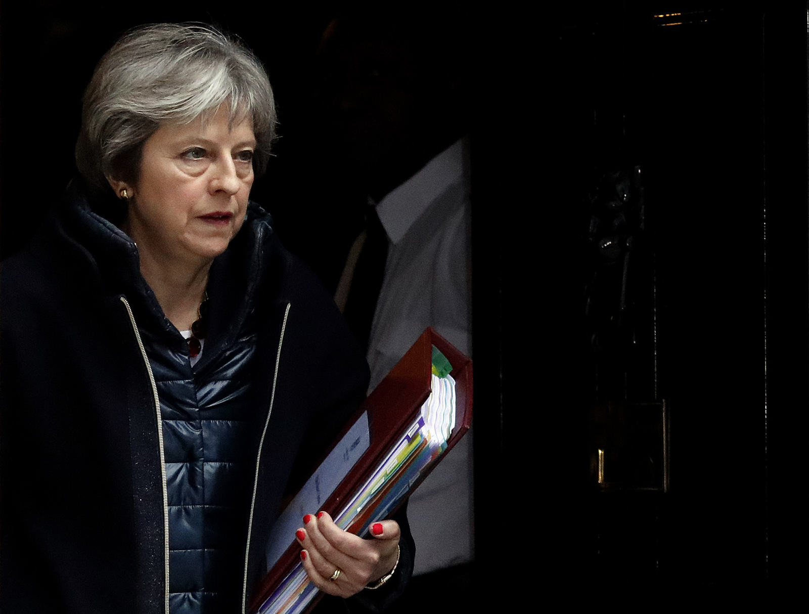 Britain's Prime Minister Theresa May leaves 10 Downing Street to attend the weekly Prime Minister's Questions session, in parliament in London, March 14, 2018. The Kremlin says Russia rejects the deadline that Britain gave it to explain any involvement in the poisoning of an ex-Russian spy. (AP/Frank Augstein)