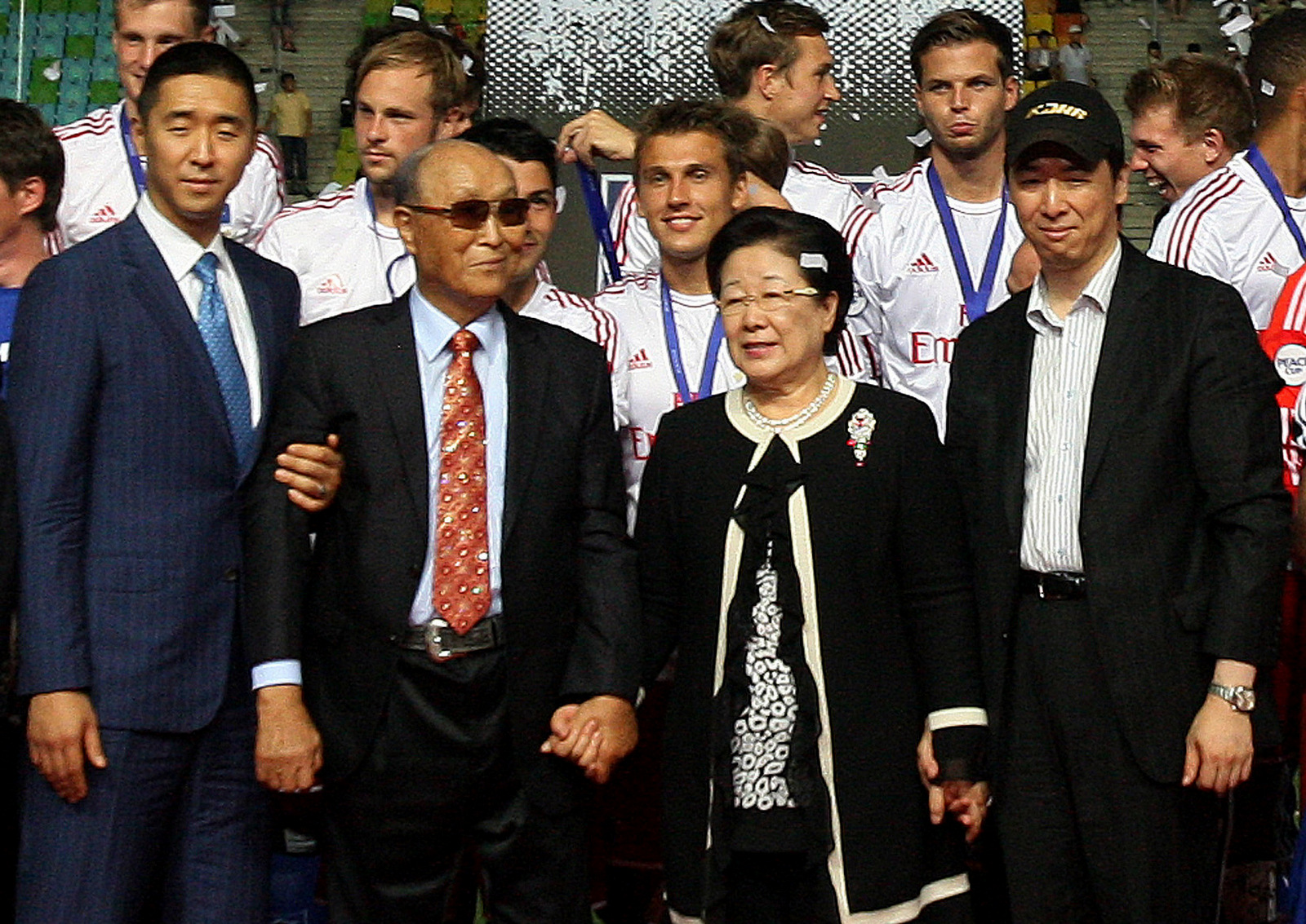 Rev. Sun Myung Moon, the founder of the Unification Church, second from left, poses with his wife Hak Ja Han Moon, second from right, his sons Hyung-jin Moon, left, and Kook Jin Moon during the closing ceremony of the 2012 Peace Cup Suwon at Suwon World Cup Stadium in Suwon, South Korea, July 22, 2012. (AP/Ahn Young-joon)