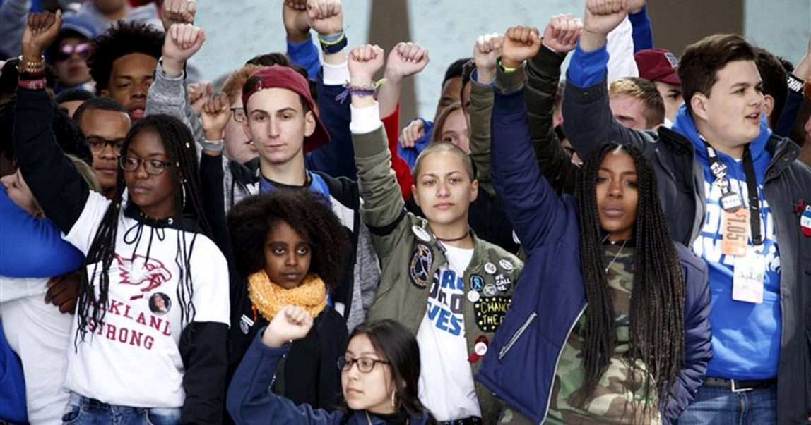 Emma Gonzalez, a survivor of the school shooting at Marjory Stoneman Douglas High School, along with students and speakers at the March For Our Lives rally in Washington on March 24, 2018. (EPA/Shawn Thew)