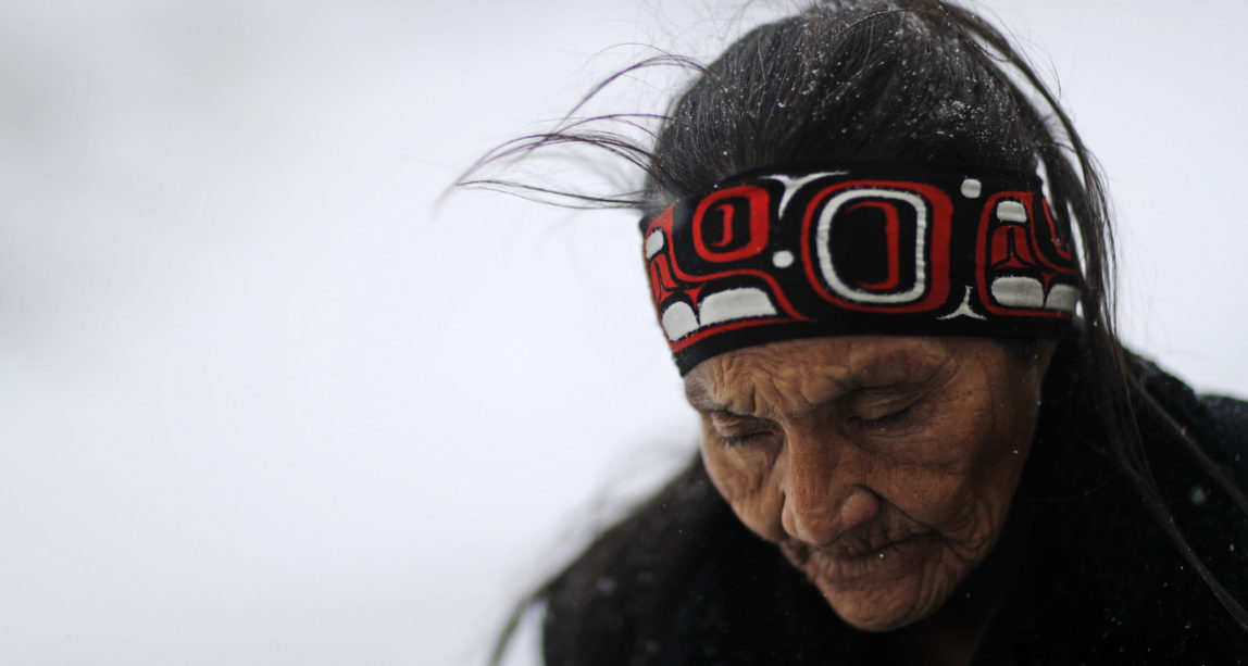Grandma Redfeather of the Sioux walks in the snow to get water at the Oceti Sakowin camp where people have gathered to protest the Dakota Access oil pipeline in Cannon Ball, N.D. "It's for my people to live and so that the next seven generations can live also," said Redfeather of why she came to the camp. "I think about my grandchildren and what it will be like for them." Nov. 29, 2016. (AP/David Goldman)