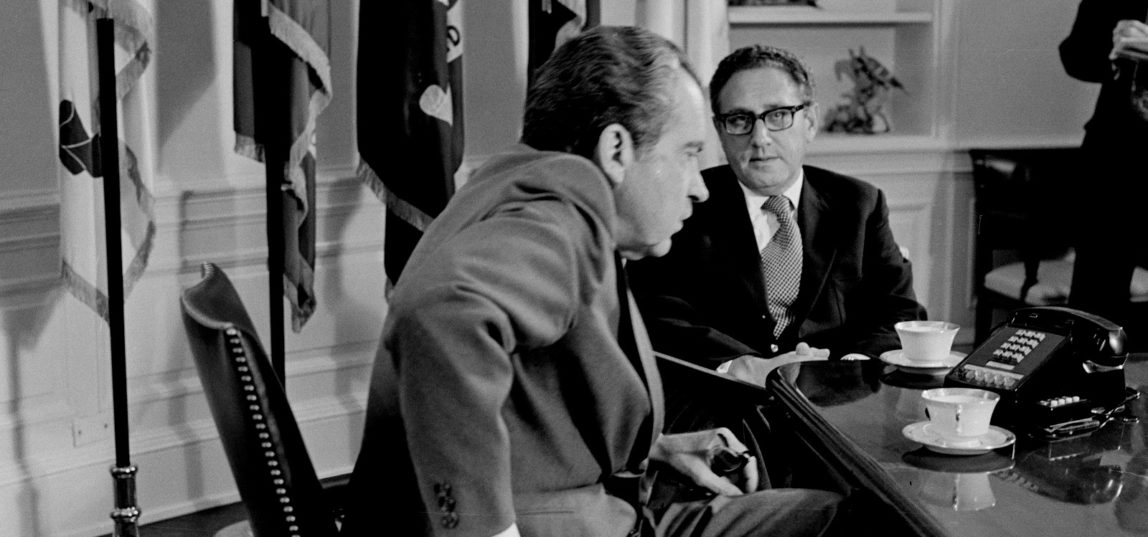 President Nixon meets Secretary of State Henry Kissinger in the Oval Office of the White House on Oct. 9, 1973. Days before the 1972 election, Kissinger declared that peace was "at hand" in Vietnam. (AP/Harvey George)