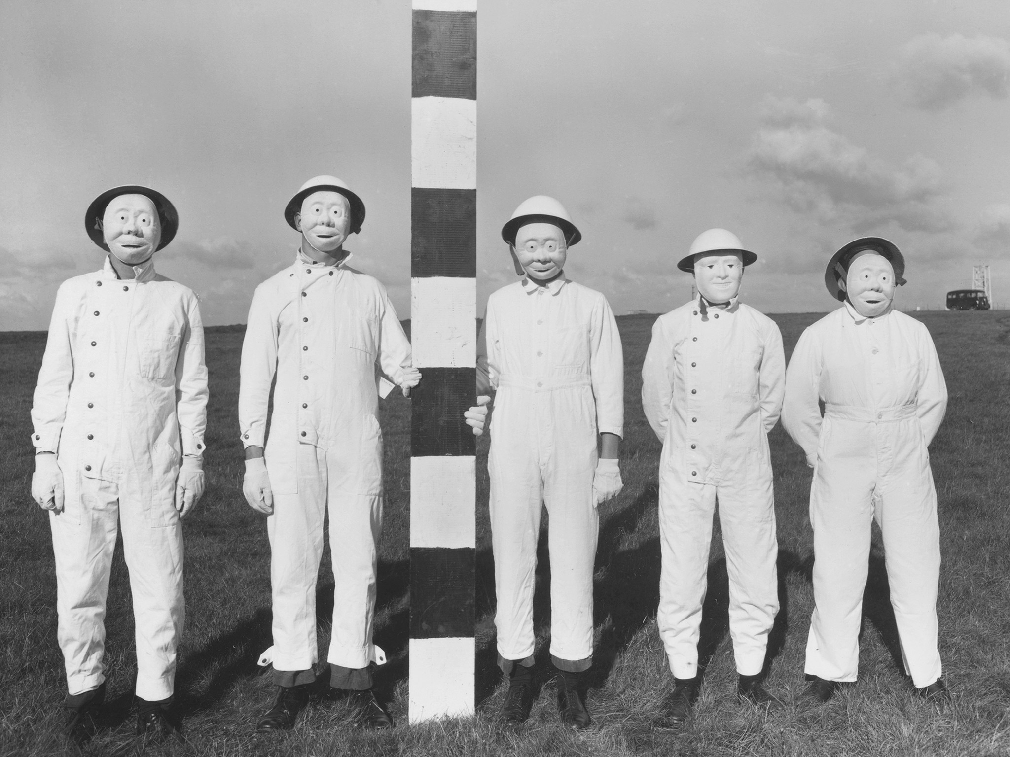 British field trial personnel in 1956. The masks had to be worn to allow the collection of proxy warfare substances that had been sprayed from aircraft. (Photo: Imperial War Museums)