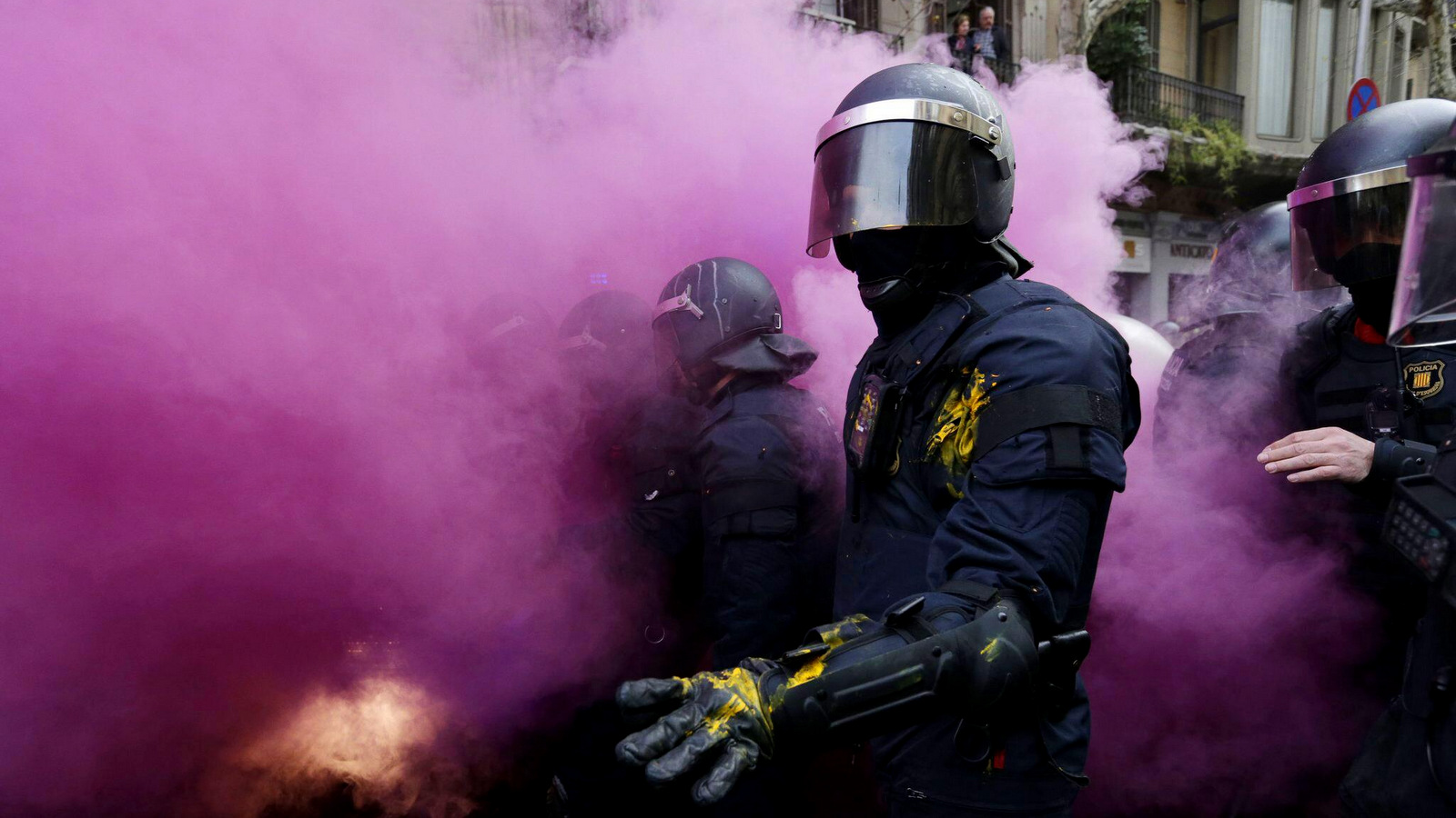 Catalan police clash with pro-independence supporters trying to reach the Spanish government office in Barcelona, Spain, March 25, 2018. Groups both for and against Catalan secession protested in Barcelona after Carles Puigdemont, the fugitive ex-leader of Catalonia and ardent separatist, was arrested by German police on an international warrant. (AP/Felipe Dana)