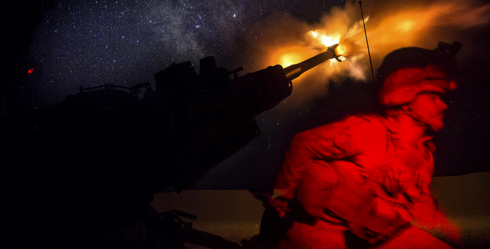 A U.S. Marine fires a howitzer in the early morning in Syria in support of the SDF (Syrian Democratic Forces), June 3, 2017. (Marines Corps Photo)