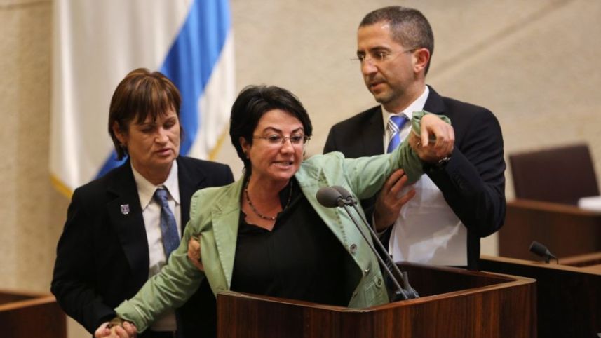 Haneen Zoabi being removed from the Knesset podium in February 2016. (Photo: Emil Salman)