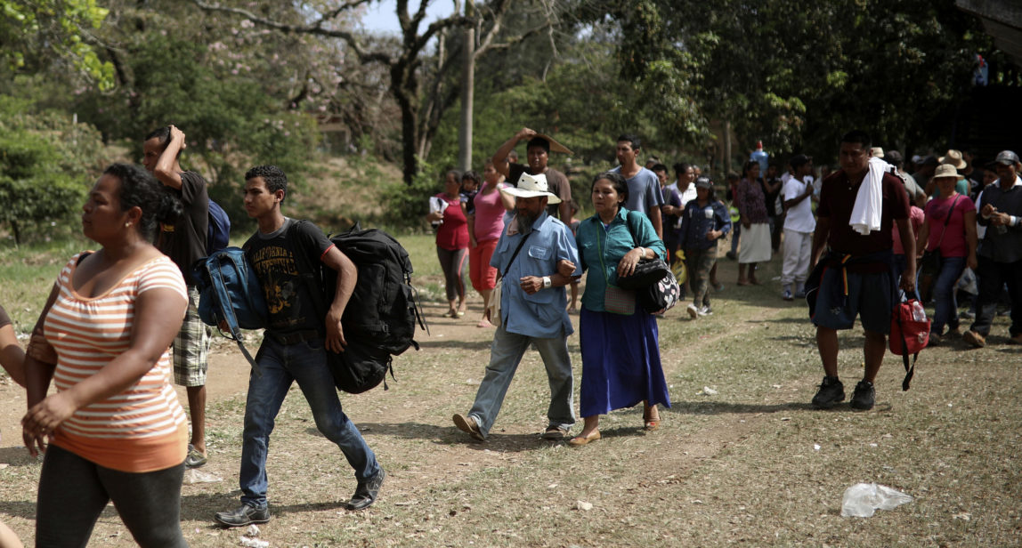 Central American migrants arrive to a sports center during the annual Migrant Stations of the Cross caravan or "Via crucis," organized by the "Pueblo Sin Fronteras" activist group, as the group makes a few-days stop in Matias Romero, Oaxaca state, Mexico, Monday, April 2, 2018. (AP/Felix Marquez)