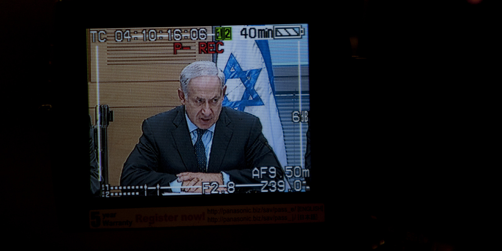 Israeli Prime Minister Benjamin Netanyahu is seen through the view-finder of a video camera. (AP/Se bastian Scheiner)