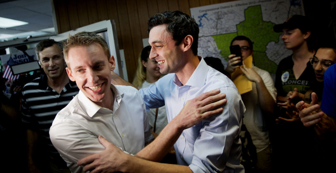 Jason Kander, left, former Missouri Secretary of State, campaigns for Jon Ossoff, Democratic candidate for Georgia's 6th congressional district, right, during a stop at Ossoff's campaign office in Chamblee, Ga., Monday, June 19, 2017. The race between Ossoff and Republican Karen Handel is seen as a significant political test for the new Trump Administration. The district traditionally goes Republican, but most consider the race too close to call as voters head to the polls on Tuesday. (AP Photo/David Goldman)