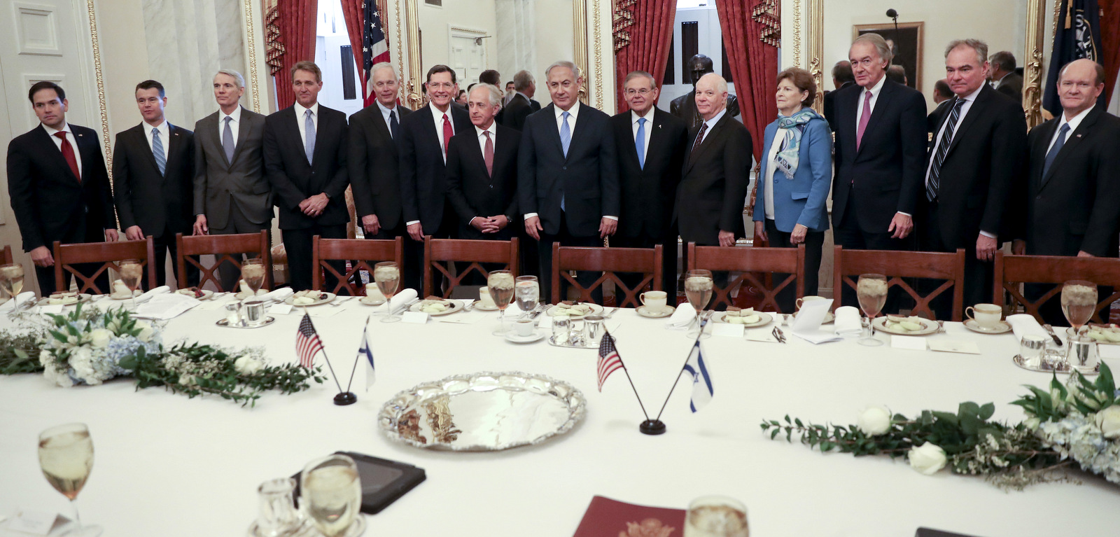 Israeli Prime Minister Benjamin Netanyahu, center, with members of the Senate Foreign Relations Committee before the start of their meeting on Capitol Hill in Washington, March 6, 2018. With Netanyahu, are from left, Sen. Marco Rubio, R-Fla., Sen. Tom Udall, D-N.M., Sen. Rob Portman, R-Ohio, Sen. Jeff Flake, R-Ariz., Sen. Ron Johnson, Sen. John Barrasso, R-Wyo., Chairman Sen. Bob Corker, R-Tenn., Ranking Member, Sen. Bob Menendez, D-N.J., Sen. Ben Cardin, D-Md., Sen. Jeanne Shaheen, D-N.H., Sen. Edward J. Markey, D-Mass., Sen. Tim Kaine, D-Va., and Sen. Chris Coons, D-Del. (AP/Pablo Martinez Monsivais)
