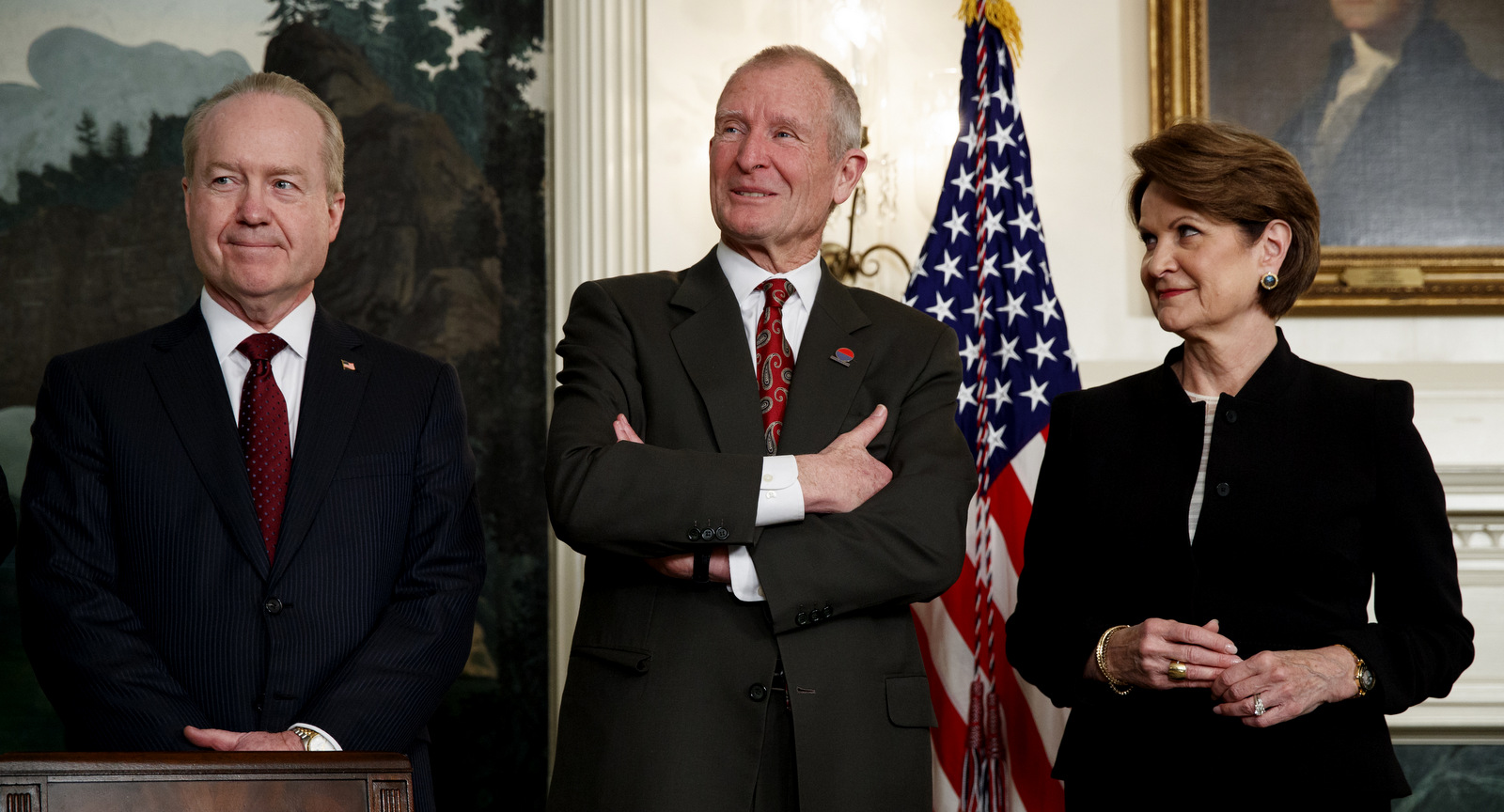 Raytheon CEO Tom Kennedy, left, former Director of National Intelligence Dennis Blair, center, and Lockheed Martin CEO Marillyn Hewson wait for the arrival of President Donald Trump in the Diplomatic Reception Room of the White House, March 22, 2018. (AP/Evan Vucci)