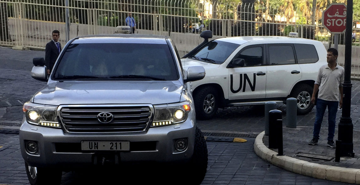 United Nations vehicles carry the team of the Organization for the Prohibition of Chemical Weapons (OPCW), arrive at hotel hours after the U.S., France and Britian launched an attack on Syria in Damascus, Syria, April 14, 2018. (AP/Bassem Mroue)