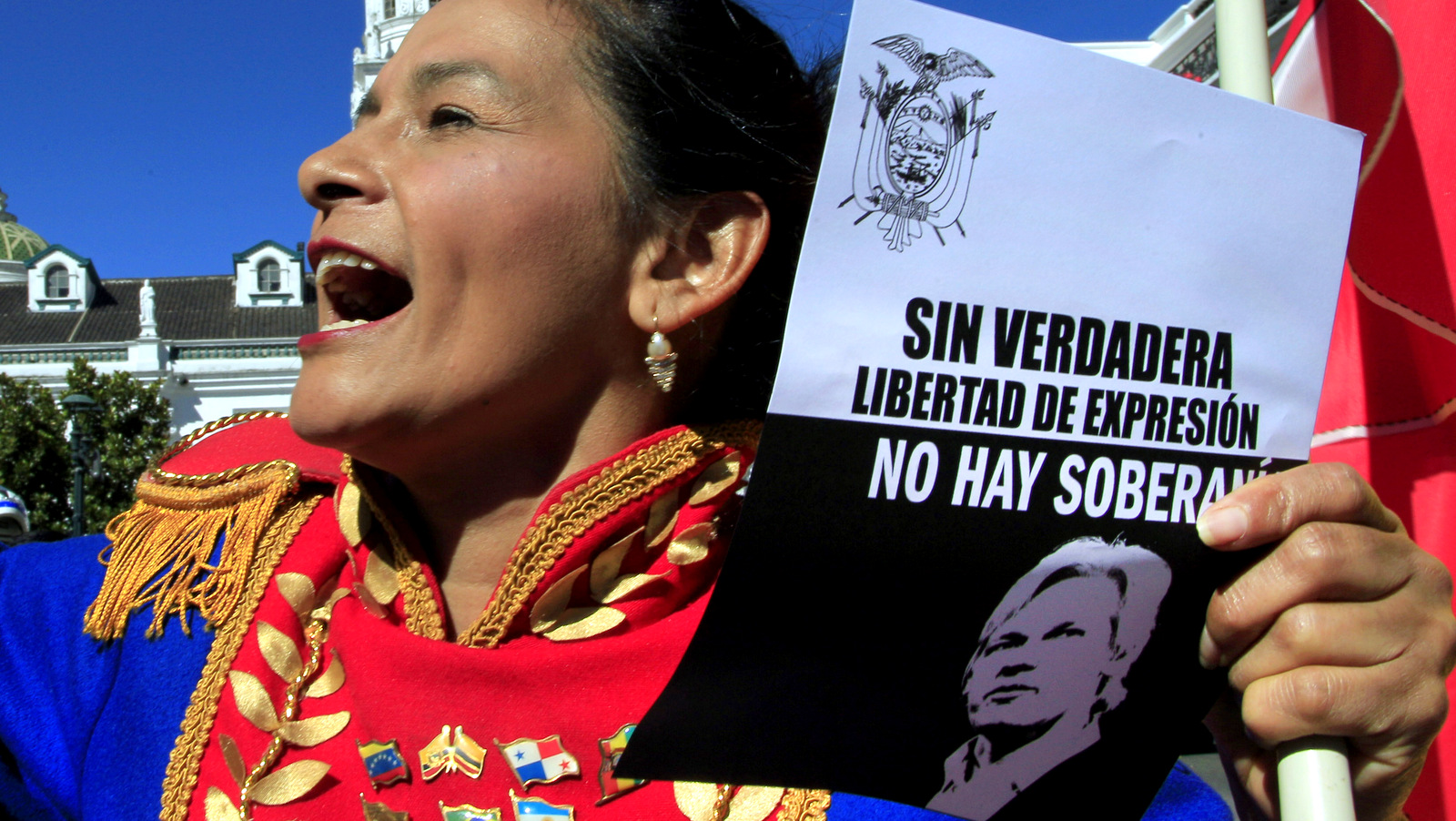 A demonstrator holds a poster with the portrait of WikiLeaks founder Julian Assange during a rally in front of the government palace in Quito, Ecuador, Monday, Aug. 20, 2012. People gathered at the square in front of the government palace to support president Correa after he granted political asylum to Assange and against the British government threats to enter Ecuador's embassy in London where Assange is confined. Legend on the poster says, "Without true freedom of expression there is no sovereignty". (AP Photo/Dolores Ochoa)