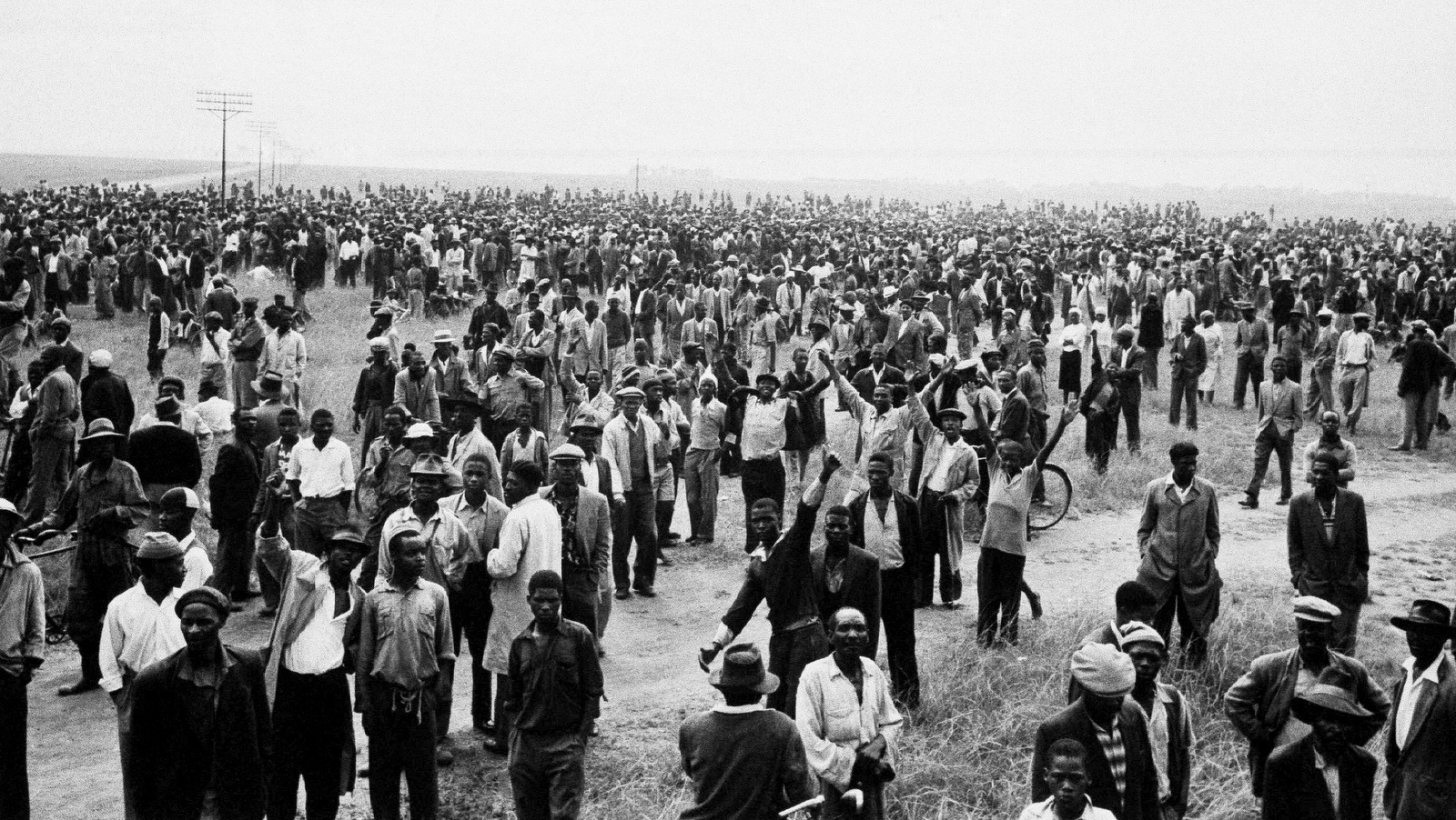 A crowd gathers at the township of Sharpeville, south of Johannesburg, South Africa, March 21, 1960, a few hours before white police opened fire on them with bren-guns. They were demonstrating against the law requiring Africans to carry passes. Sixty Africans were killed and hundreds injured in the shooting. (AP Photo/ Cape Argus)