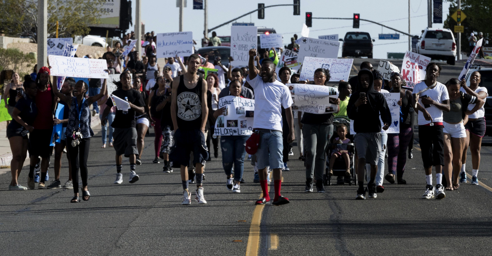Protesters fill Barstow road in Barstow CA on Tuesday April 10, 2018 as part of a protest against the officer involved shooting of Diante "Butchie" Yarber. (James Quigg/Daily Press via AP)