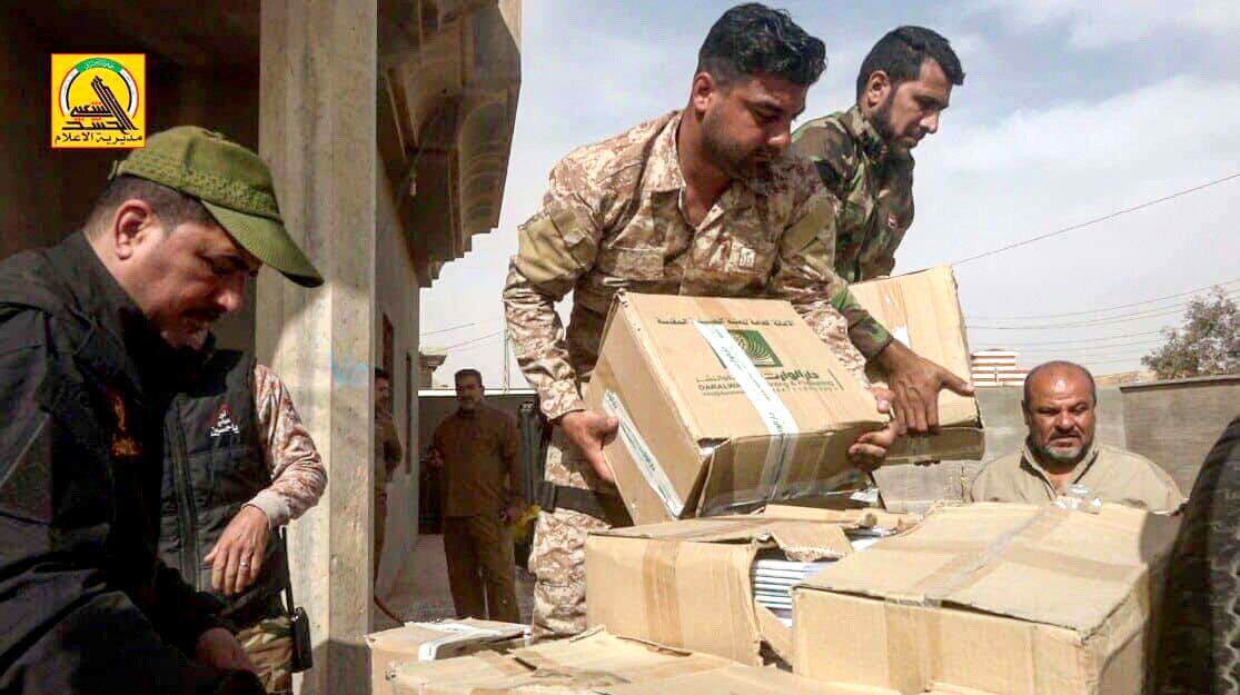 Popular Mobilization Forces and Imam Hussain Shrine start a joint campaign to distribute school books western Al-Anbar City