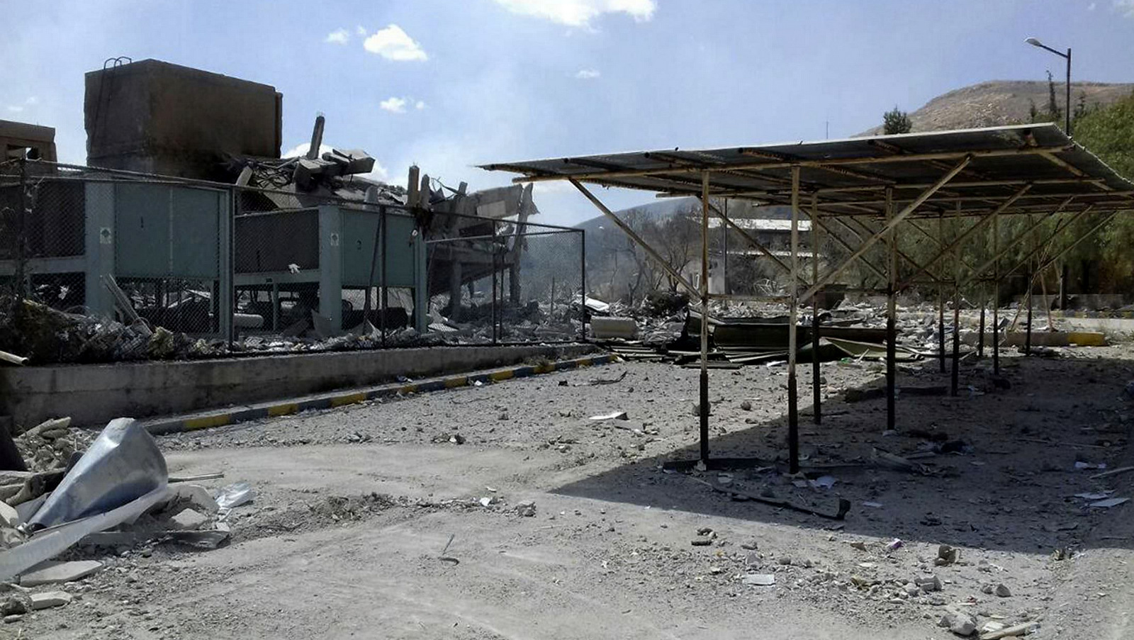 The damage of the Syrian Scientific Research Center which was attacked by U.S., British and French military strikes in Barzeh, near Damascus, Syria, April 14, 2018. Russia's military said Syrian air defense units downed 71 out of 103 cruise missiles launched by the U.S. and its allies. (SANA via AP)