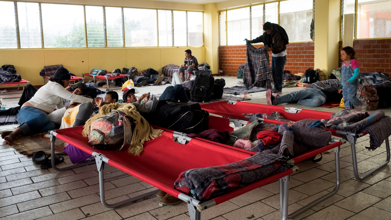 Migrants settle in at the Casa del Peregrino, near the Basilica de Guadalupe, in Mexico City, April 10, 2018.