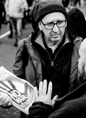 Two men debate at the "stop bombing Syria" protest march on 12th December 2015, Regent Street, London.