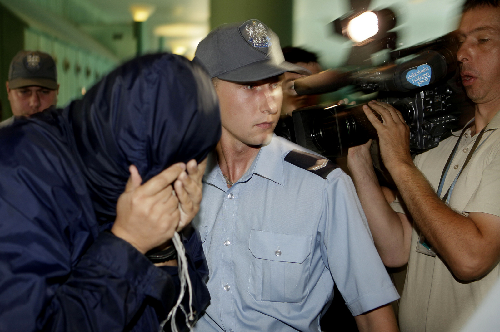 Uri Brodsky, believed to be a Mossad agent involved in the assassination of Mahmoud al-Mabhouh, is escorted by police to a court of appeal session in Warsaw, Poland, Aug. 5, 2010. (AP/Czarek Sokolowski)