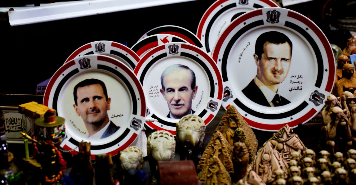 Photo, porcelain plates bearing portraits of Syrian President Bashar Assad and his father late Syrian President Hafez Assad are displayed in a souvenirs shop outside the historic 7th century Umayyad Mosque, in Damascus, Syria, April 17, 2016. (AP/Hassan Ammar)
