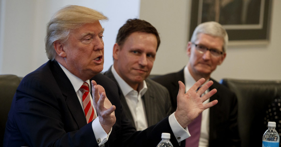 Peter Thiel founder of CIA-funded Palantir, listens as Donald Trump speaks during a meeting with tech leaders at Trump Tower in New York, Dec. 14, 2016. (AP/Evan Vucci)