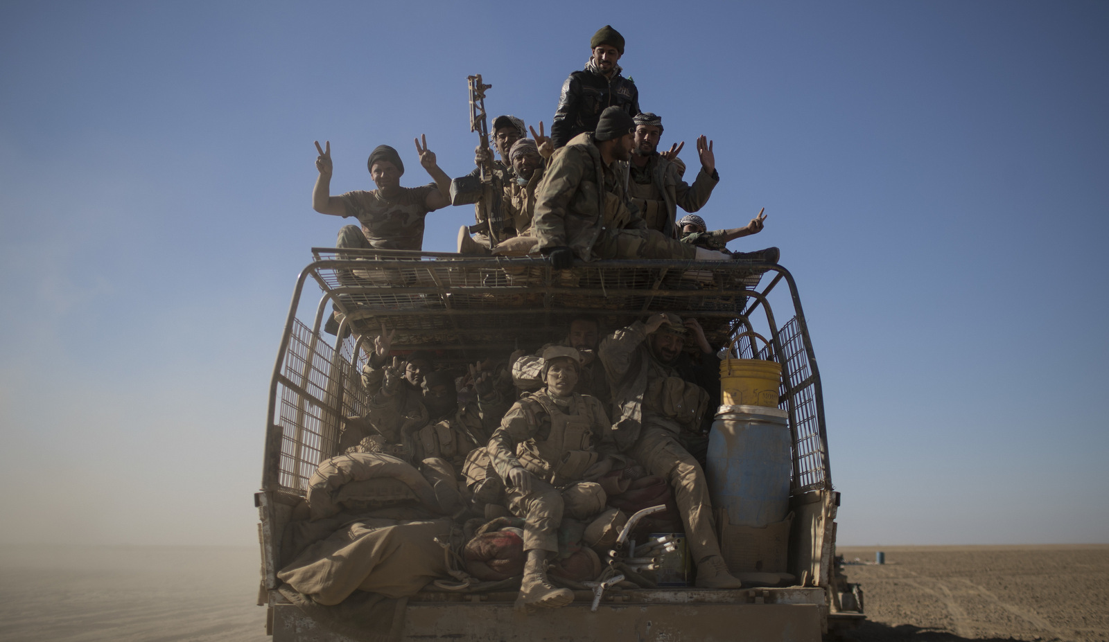 Member of Iraq's Popular Mobilization Units, which are closely aligned with Iran, could quickly turn on US forces in a third Gulf War. (AP/Felipe Dana)