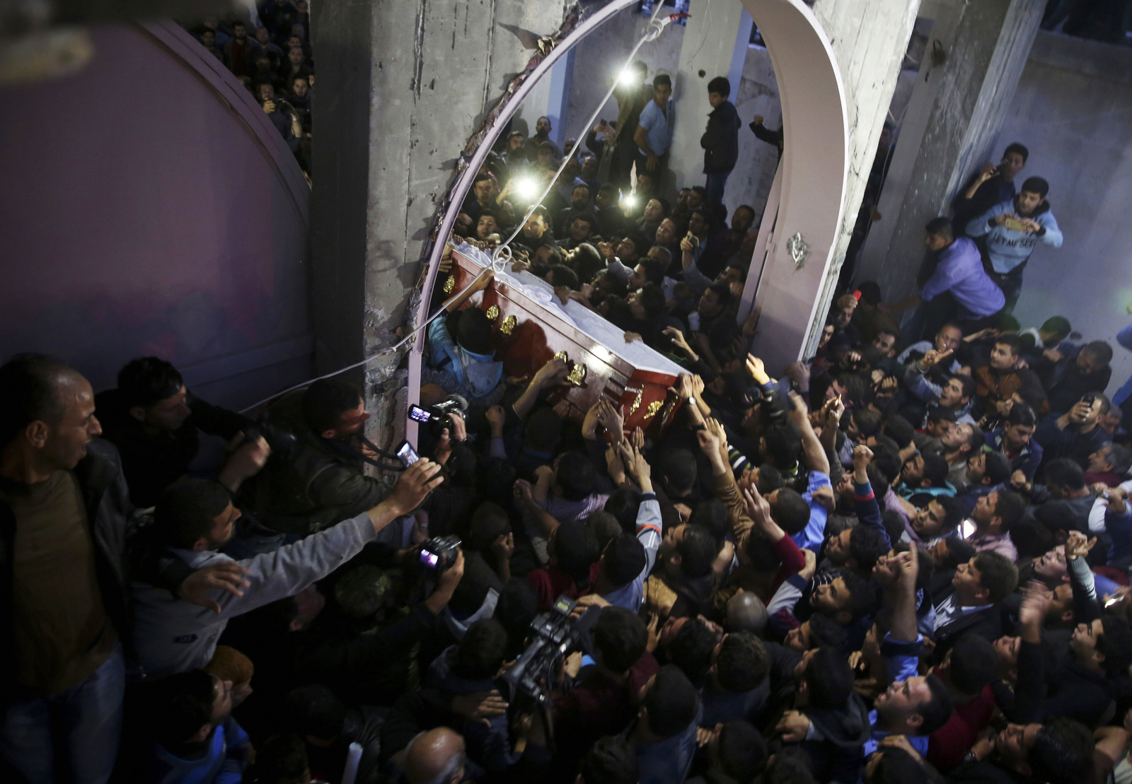Mourners carry the coffin of Palestinian scientist Fadi al-Batsh, after his body crossed into the Gaza Strip from Egypt during his funeral April 26, 2018. (AP/Adel Hana)