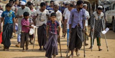 Wounded Rohingya refugees walk with the help of crutches as they await the arrival of a U.N. Security Council team at the Kutupalong Rohingya refugee camp in Kutupalong, Bangladesh, Sunday, April 29, 2018. A U.N. Security Council team visiting Bangladesh promised Sunday to work hard to resolve a crisis involving hundreds of thousands of Rohingya Muslims who have fled to the country to escape military-led violence in Myanmar. (AP/A.M. Ahad)