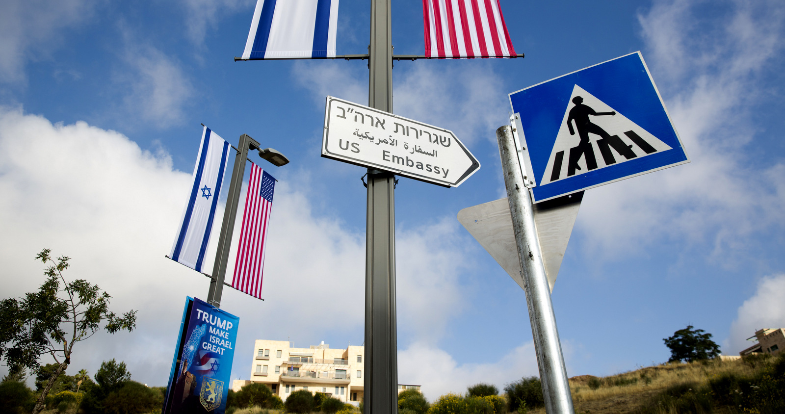 A road sign leading to the U.S. Embassy is seen ahead the official opening in Jerusalem, Sunday, May 13, 2018. Monday's opening of the U.S. Embassy in contested Jerusalem, cheered by Israelis as a historic validation, is seen by Palestinians as an in-your-face affirmation of pro-Israel bias by President Donald Trump and a new blow to frail statehood dreams. (AP Photo/Ariel Schalit)