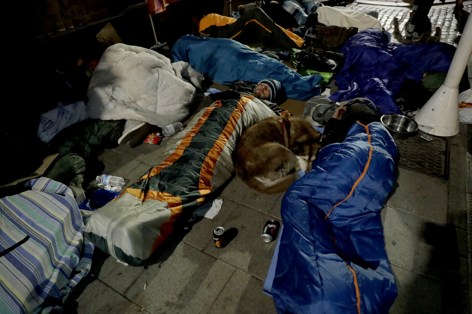 Before sunrise, Andrew Funk from the charity 'Homeless Entrepreneur', lies in a sleeping bag near Windsor Castle, ahead of royal wedding in London, May 19, 2018. (AP/Matt Dunham)
