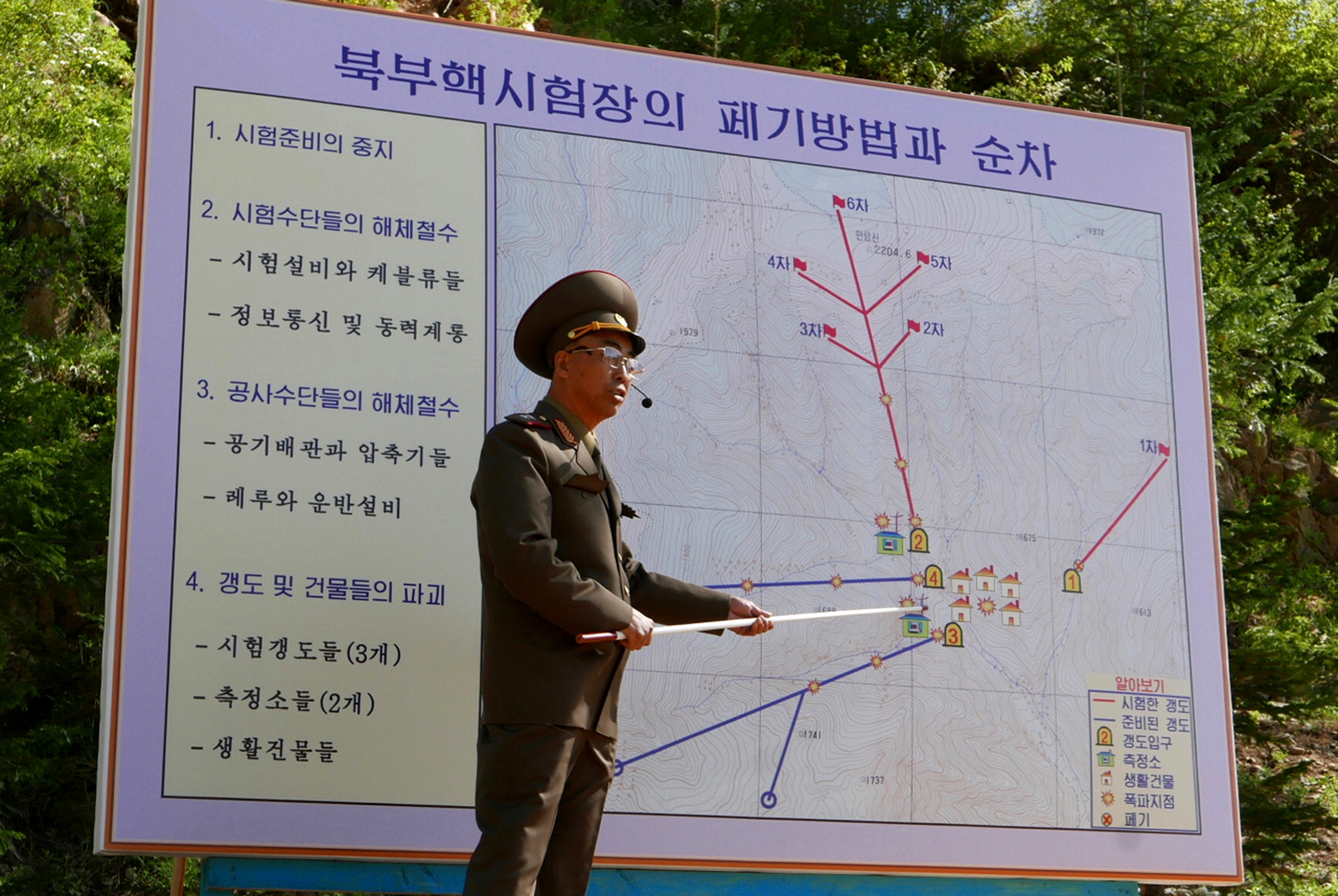 The Deputy Director of North Korea's Nuclear Weapons Institute briefs reporters about the dismantling of North Korea's nuclear test site, in Punggye-ri, May 24, 2018. APTN via AP