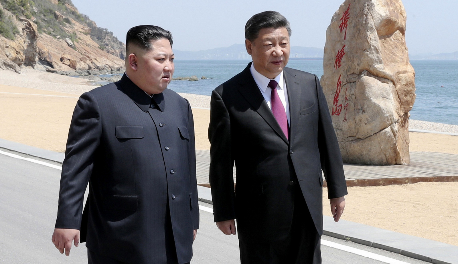 Chinese President Xi Jinping, right speaks to North Korean leader Kim Jong Un in Dalian in northeastern China's Liaoning Province. (Ju Peng/Xinhua via AP)
