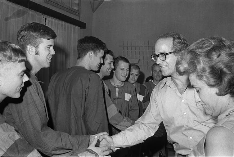 Coffin’s activism: William Sloane Coffin Jr. greets captured American pilots in Hanoi, Vietnam. (AP/Peter Arnett)