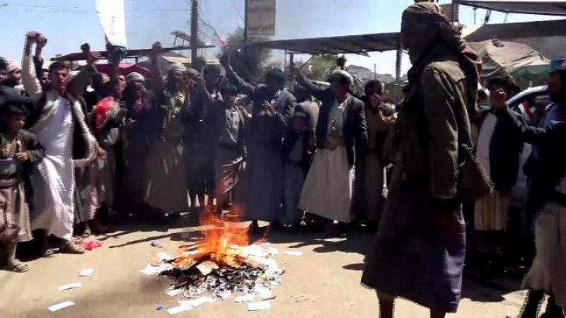 Yemeni gather and burn inflammatory leaflets encouraging sectarianism cast by Saudi aircraft in Sa`ada, Northern Yemen, May 10, 2018. (Phoot: MintPress News)