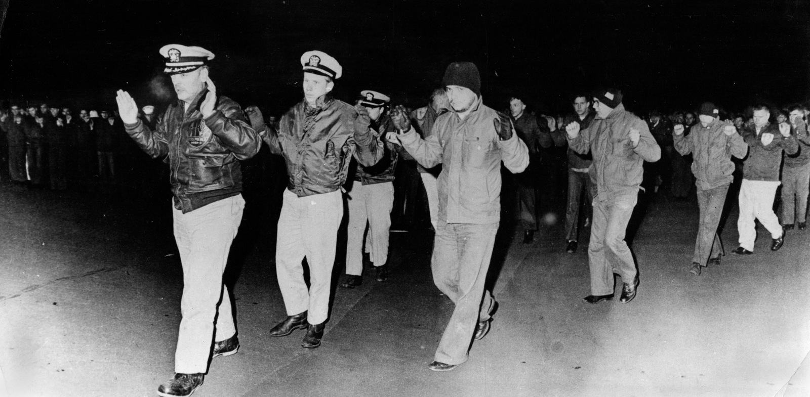 Crew members of the USS Pueblo are led into captivity after the vessel was seized by North Korean patrol boats in the Sea of Japan on Jan. 23, 1968. | AP