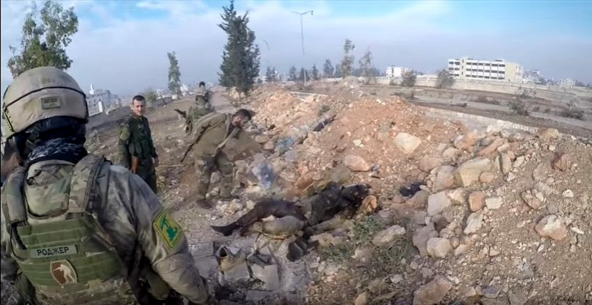 A Russian special forces unit dawns a Hezbollah patch, allowing it to operate alongside the group during operations in Aleppo. Screenshot | SouthFront