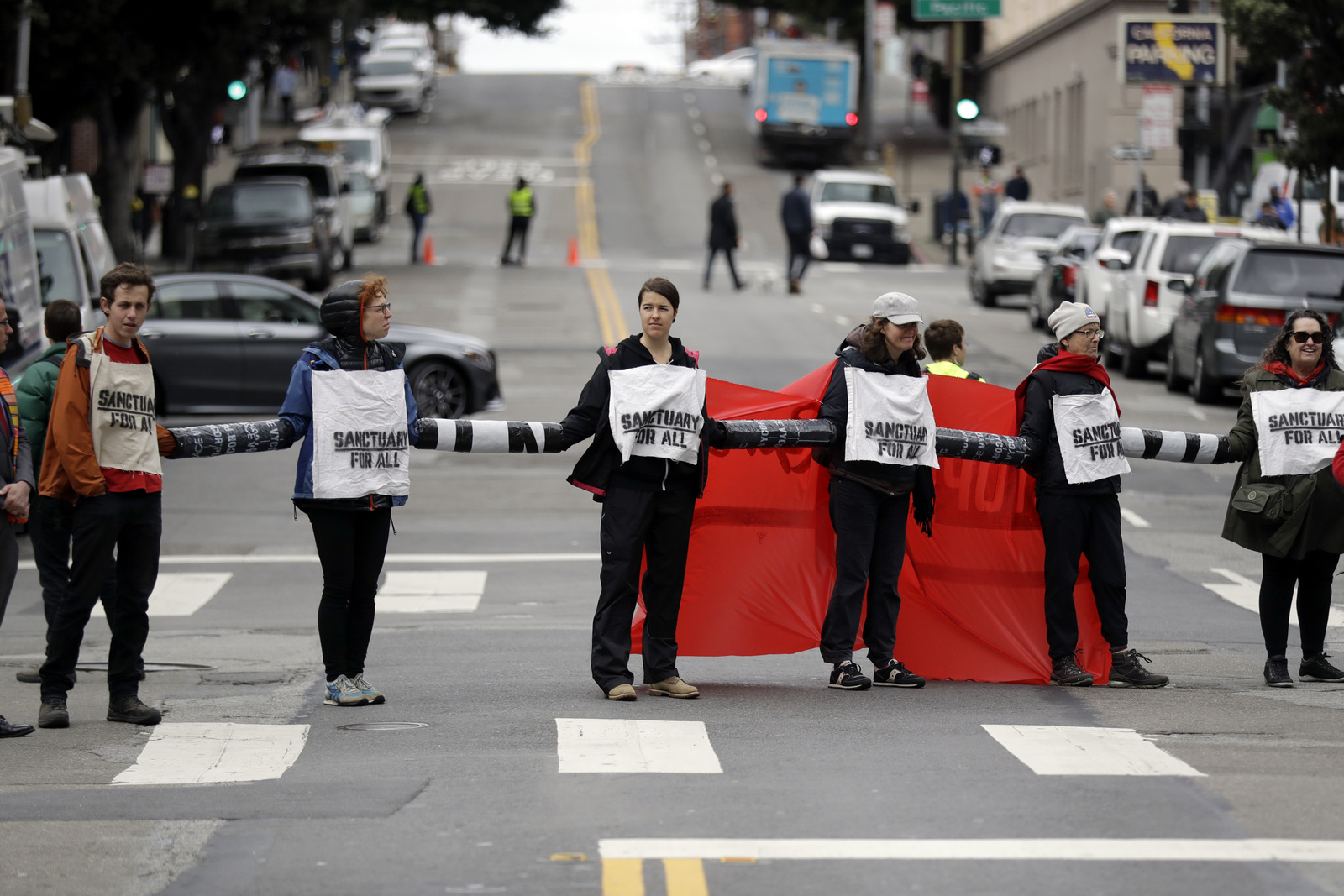 Demonstrators block an intersection outside of the Immigration and Customs Enforcement offices, Feb. 28, 2018, in San Francisco. Marcio Jose Sanchez | AP
