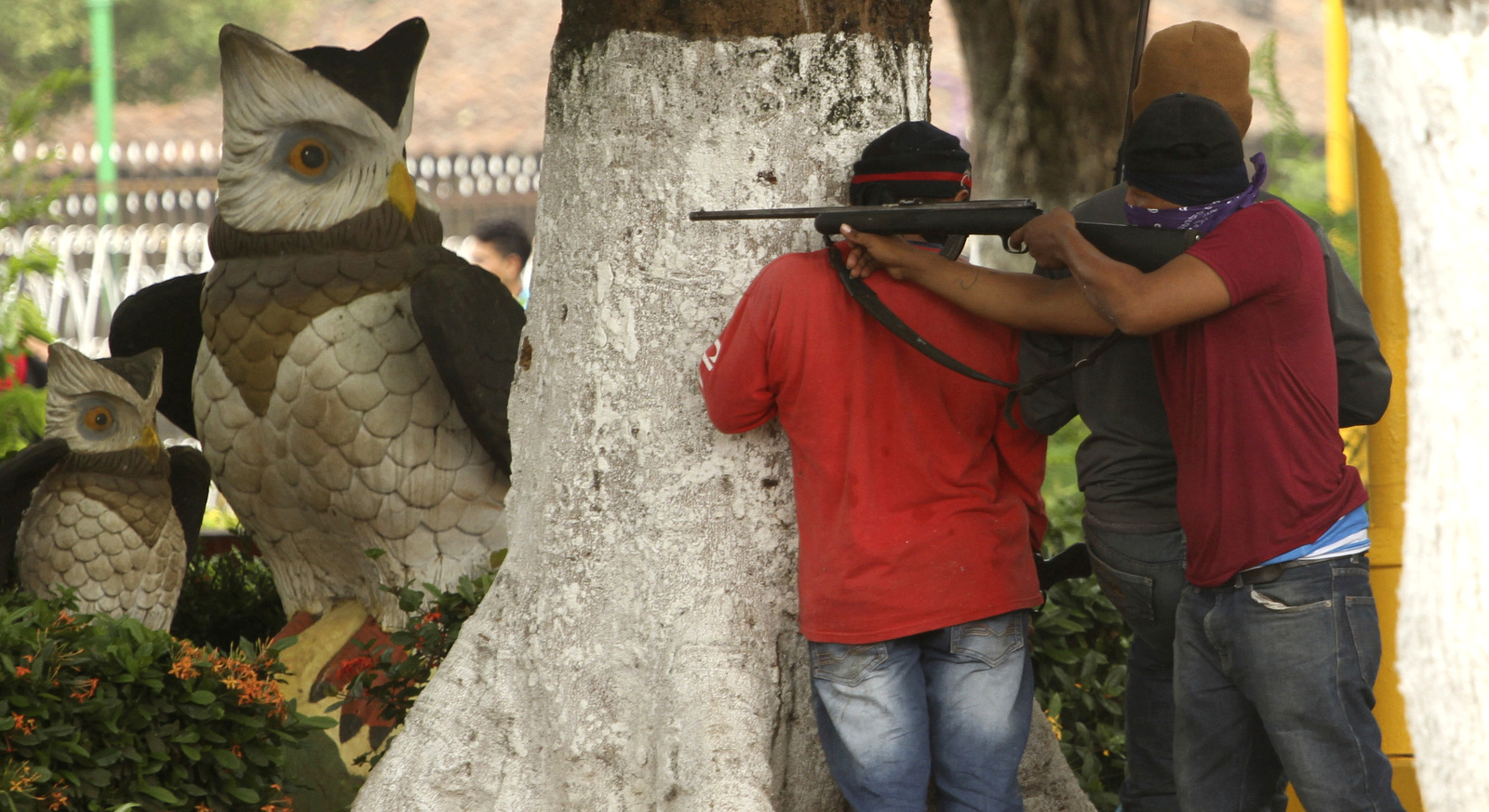 Members of the Nicaragua's opposition aim hunting rifles at police during protests in Masaya, Nicaragua, June 9, 2018. Oscar Duarte | AP