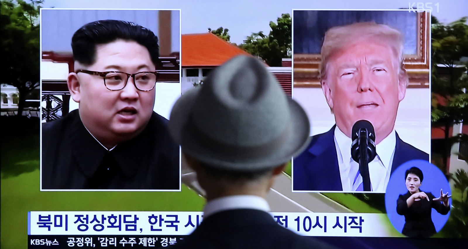 A man watches a TV screen showing file footage of U.S. President Donald Trump, right, and North Korean leader Kim Jong Un during a news program at the Seoul Railway Station in Seoul, South Korea, Monday, June 11, 2018. Ahn Young-joon | AP
