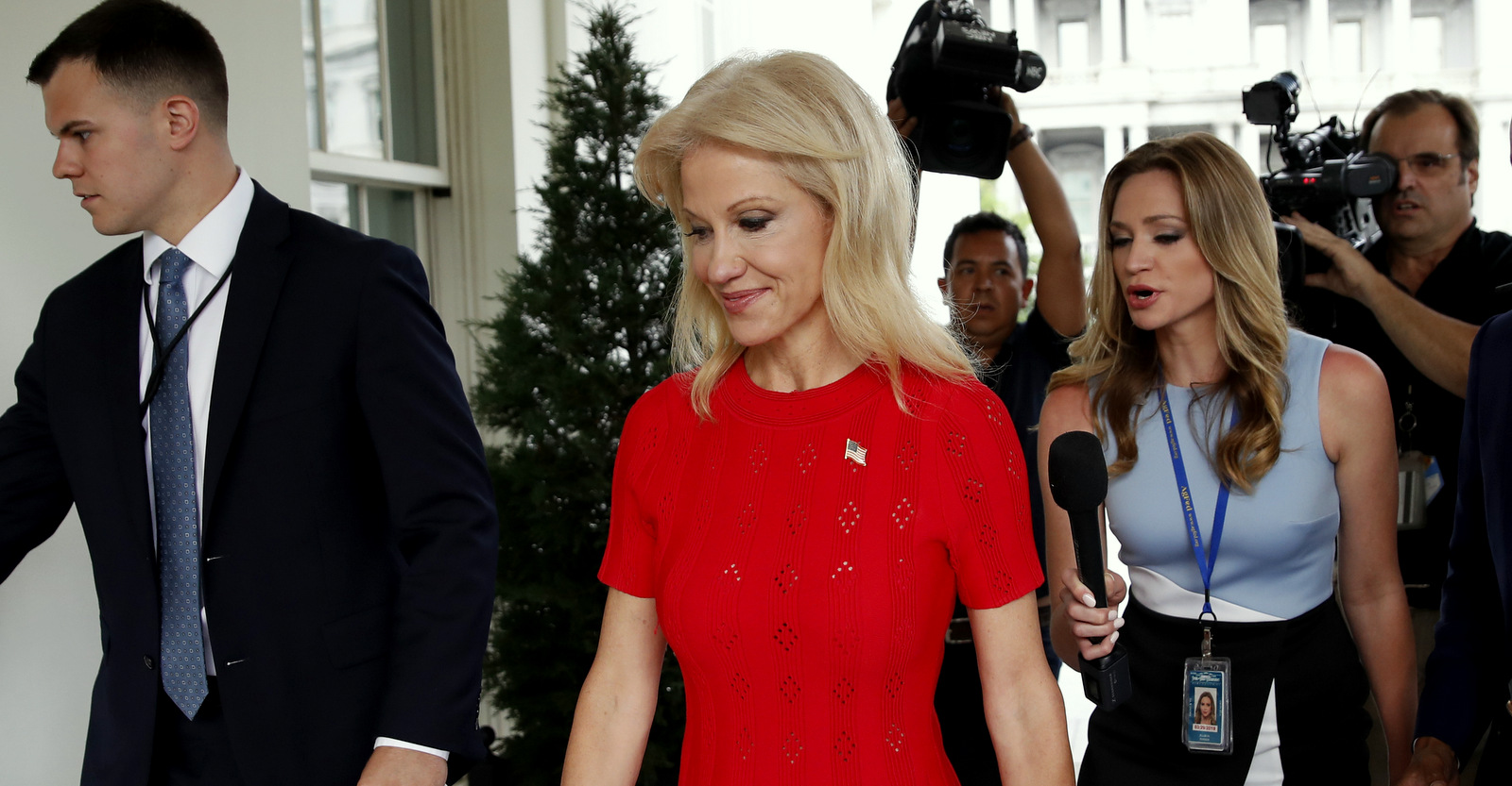 Counselor to the President Kellyanne Conway, center, walks back into the West Wing of the White House, Wednesday, June 13, 2018, in Washington. (AP Photo/Alex Brandon)