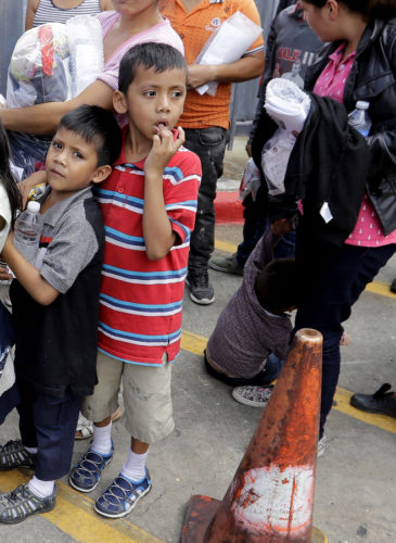 Immigrant families line up to enter the central bus station after they were processed and released by U.S. Customs and Border Protection, Sunday, June 24, 2018, in McAllen, Texas. David J. Phillip | AP