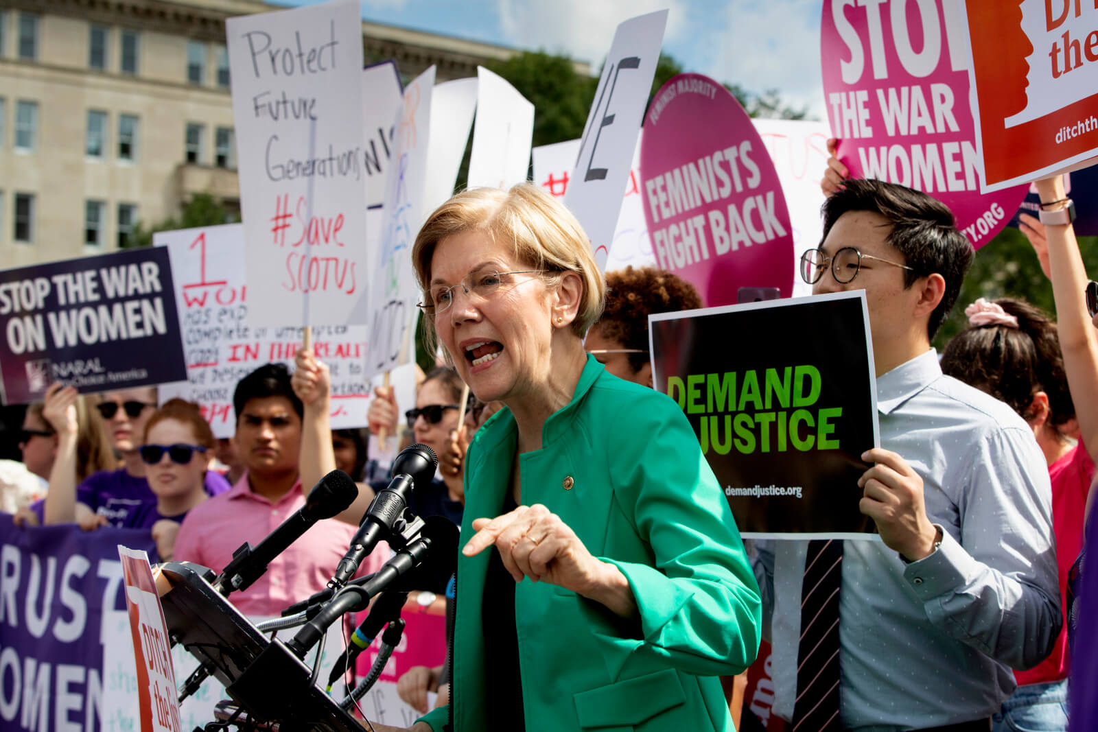 Sen. Elizabeth Warren, D-Mass., joins activists at the Supreme Court as President Donald Trump prepares to choose a replacement for Justice Anthony Kennedy, on Capitol Hill in Washington, June 28, 2018. J. Scott Applewhite | AP