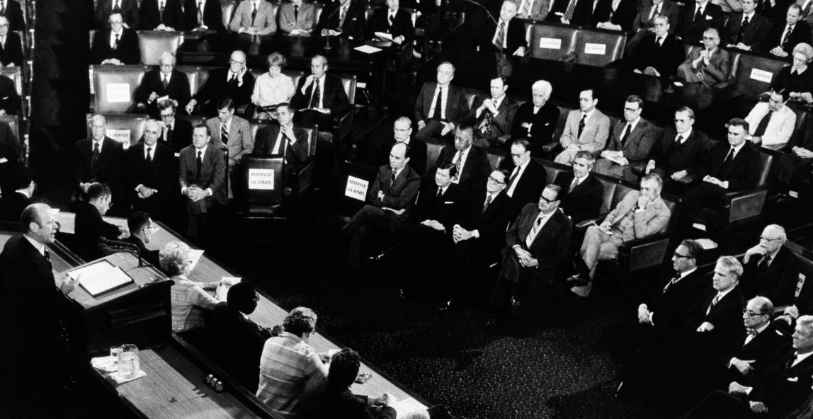 President Ford addresses a joint session of Congress April 11, 1975, where he asked the lawmakers for nearly $1 billion in emergency military and economic aid for South Vietnam. Empty seats are visible in the House Chamber as the Chief Executive delivers his State of the World Speech. (AP Photo)