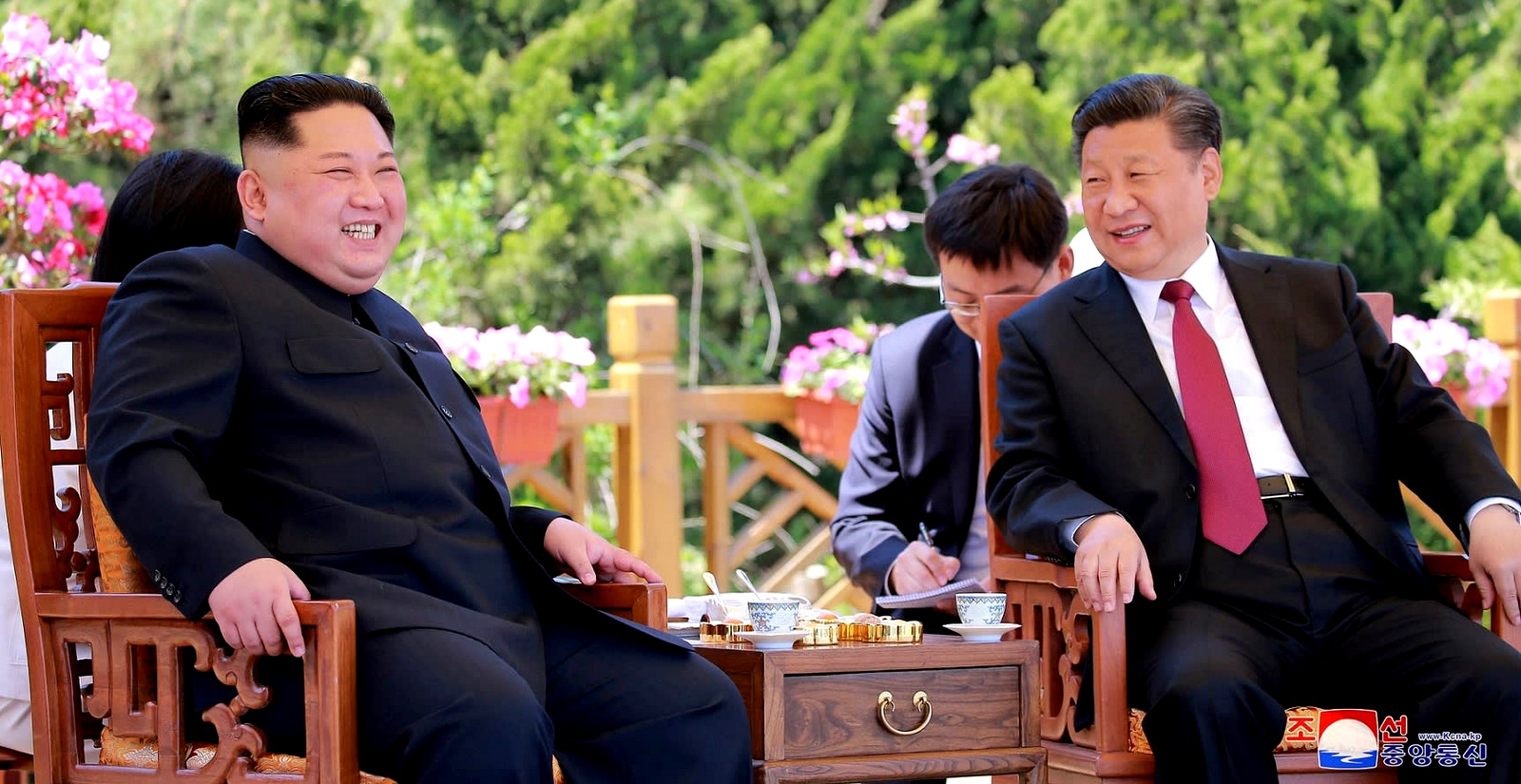 Chinese President Xi Jinping, right, hosts North Korean leader Kim Jong Un in Dalian, China in this undated photo released on May, 9 2018 by KCNA.